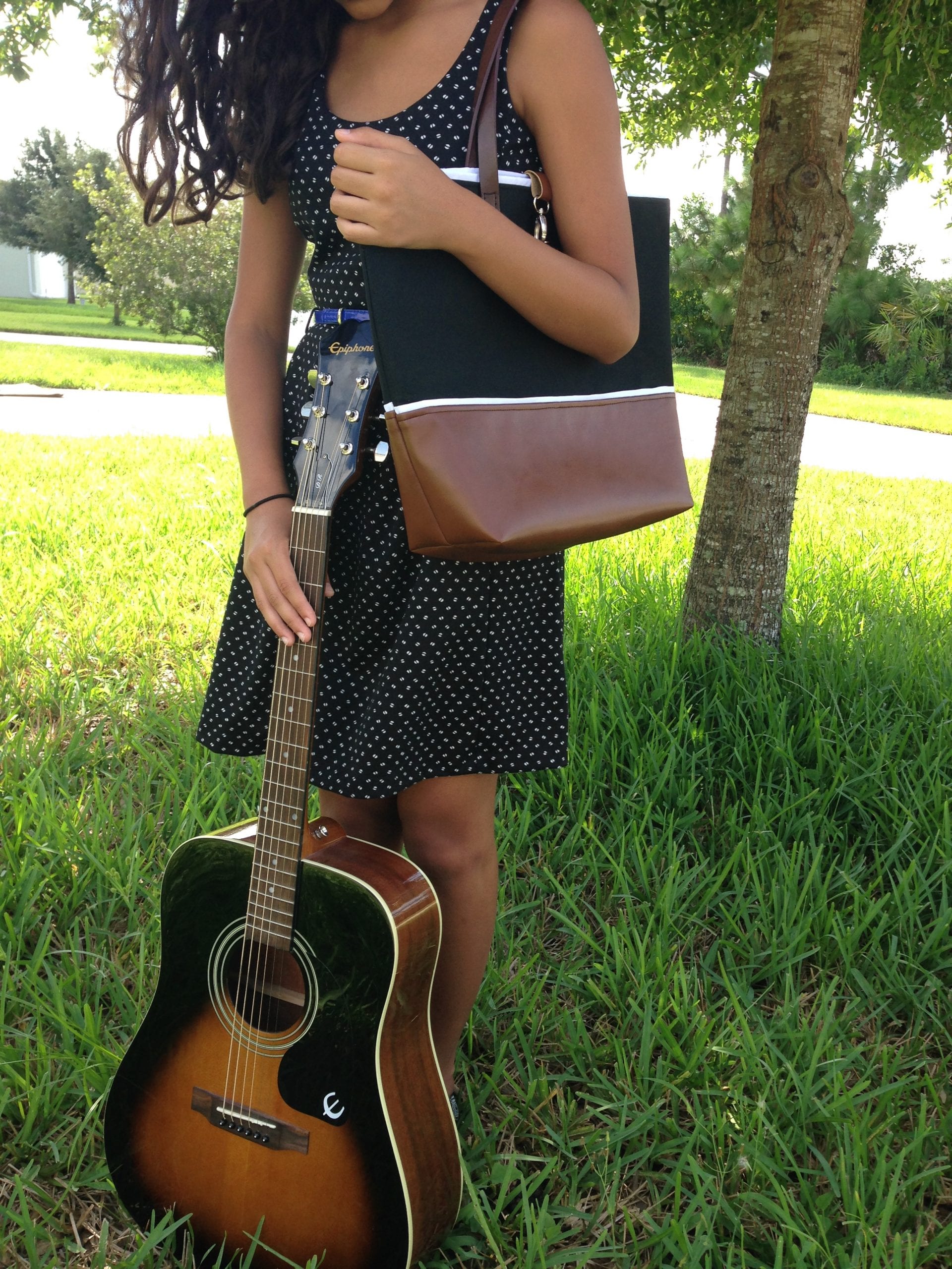 Blackout-Leather-Tote-wanda-lopez-designs-modeled-with-guitar